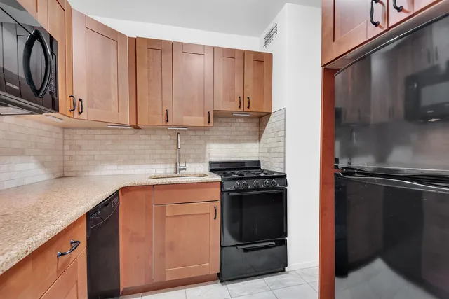 a view of living room with furniture and window