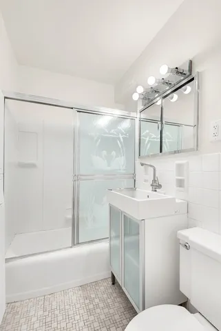 a kitchen with a sink stove and refrigerator