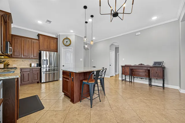 a living room with fireplace furniture and a wooden floor