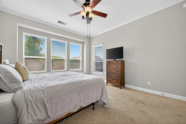 a bathroom with a granite countertop sink a mirror and a bathtub next to a window