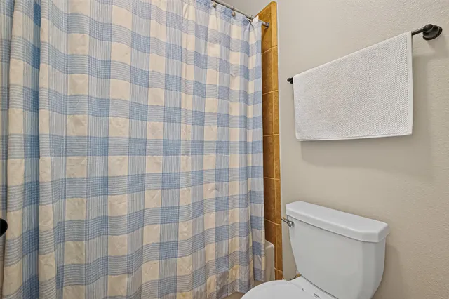 a living room with furniture a baby crib and a couch