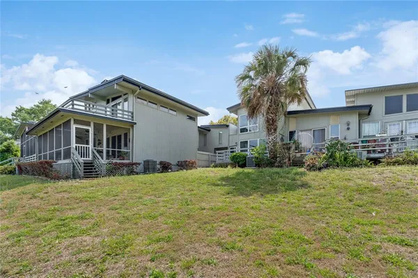 a view of a lake with houses in the back