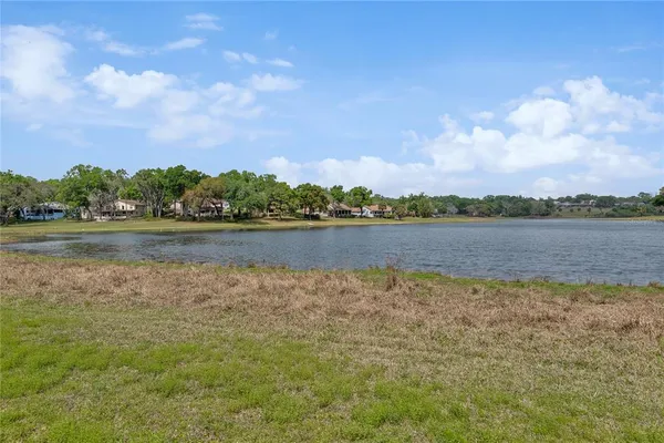 an aerial view of a house with a lake view