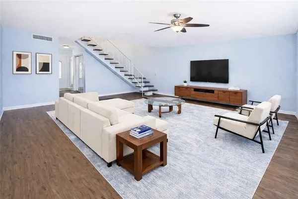 a living room with furniture and a flat screen tv