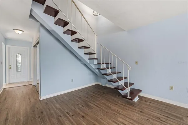 a view of entryway with wooden floor