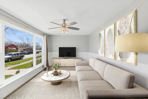 a living room with furniture and a large window