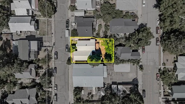 an aerial view of multiple houses with outdoor space