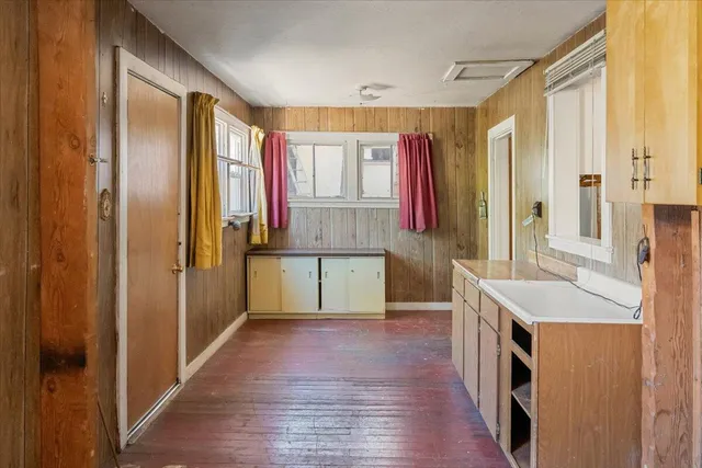 a bathroom with a sink a mirror and a shower
