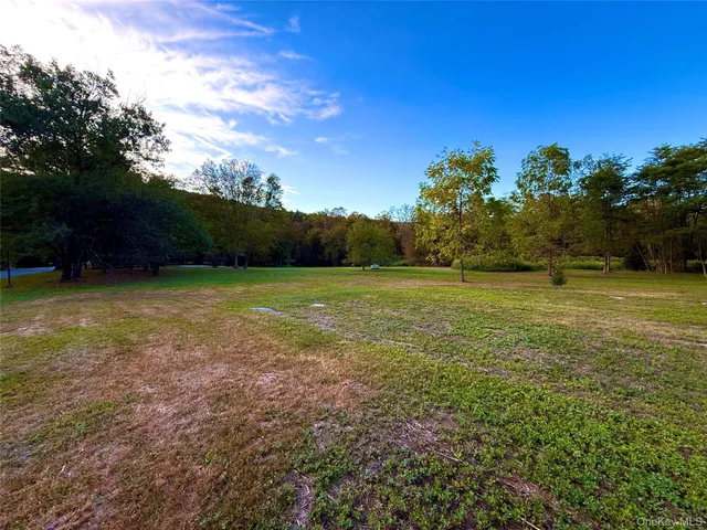 a view of a field with an outdoor space