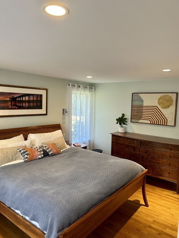 97 Elmwood Road Wellesley, MA 02481 - Photo 8 of 24 a bedroom with a bed and a dresser