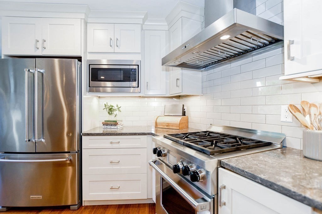12 Forster Road Rochester, MA 02770 - Photo 4 of 42 a kitchen with stainless steel appliances granite countertop a stove and a refrigerator