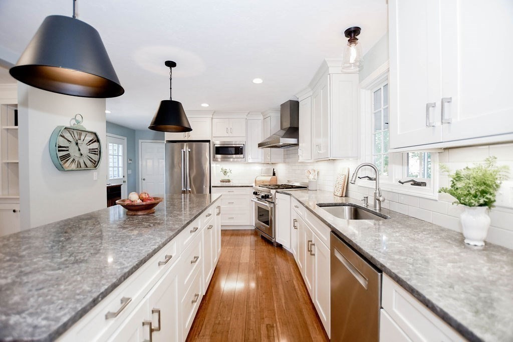12 Forster Road Rochester, MA 02770 - Photo 5 of 42 a large kitchen with stainless steel appliances granite countertop a sink a stove and a wooden floors