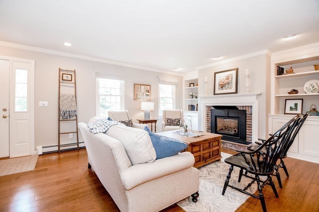 12 Forster Road Rochester, MA 02770 - Photo 9 of 42 a living room with furniture and a fireplace