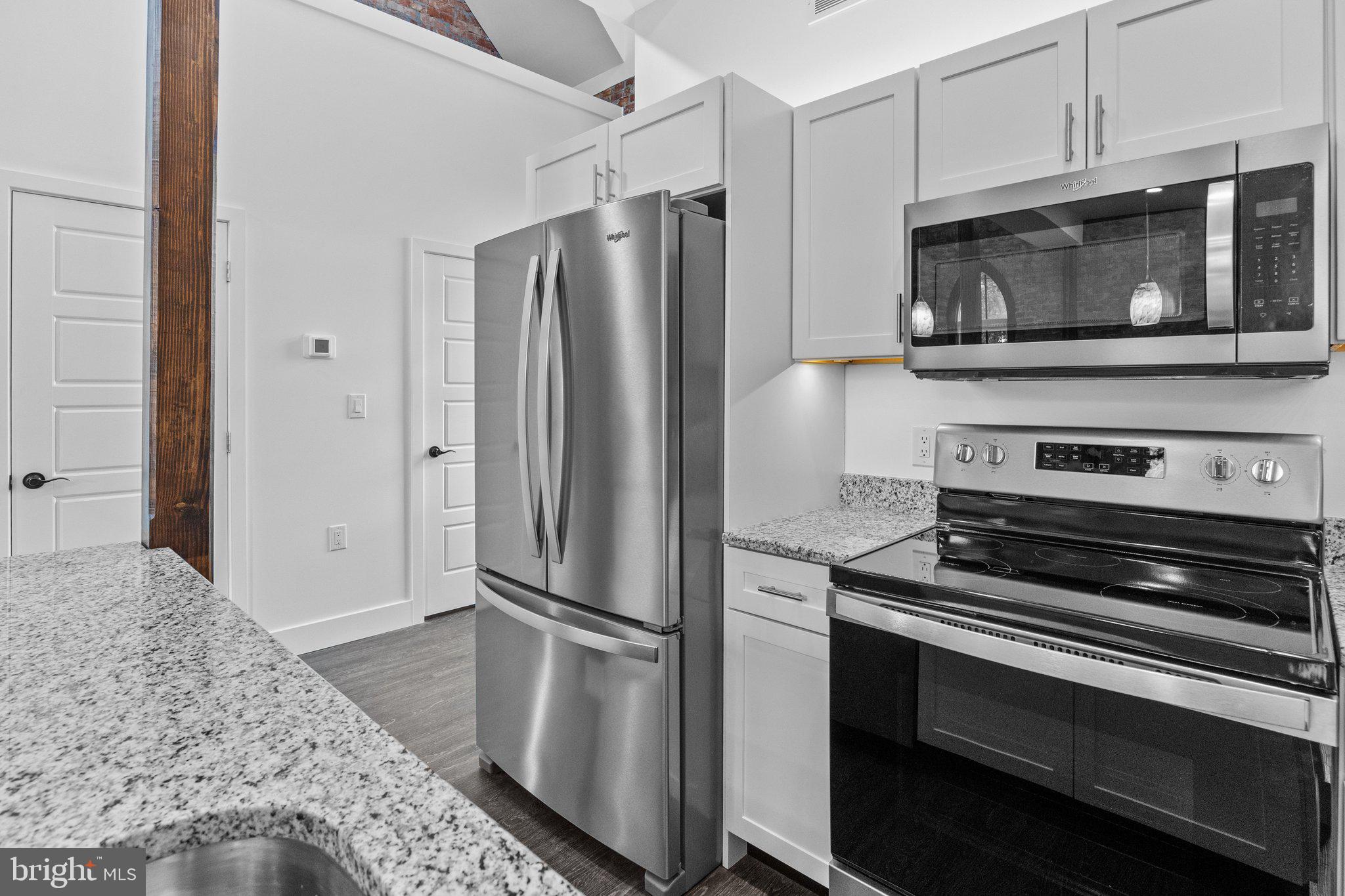 819 Blooming Glen Road, Unit 4 Perkasie, PA 18944 - Photo 3 of 21 a kitchen with a refrigerator stove and microwave
