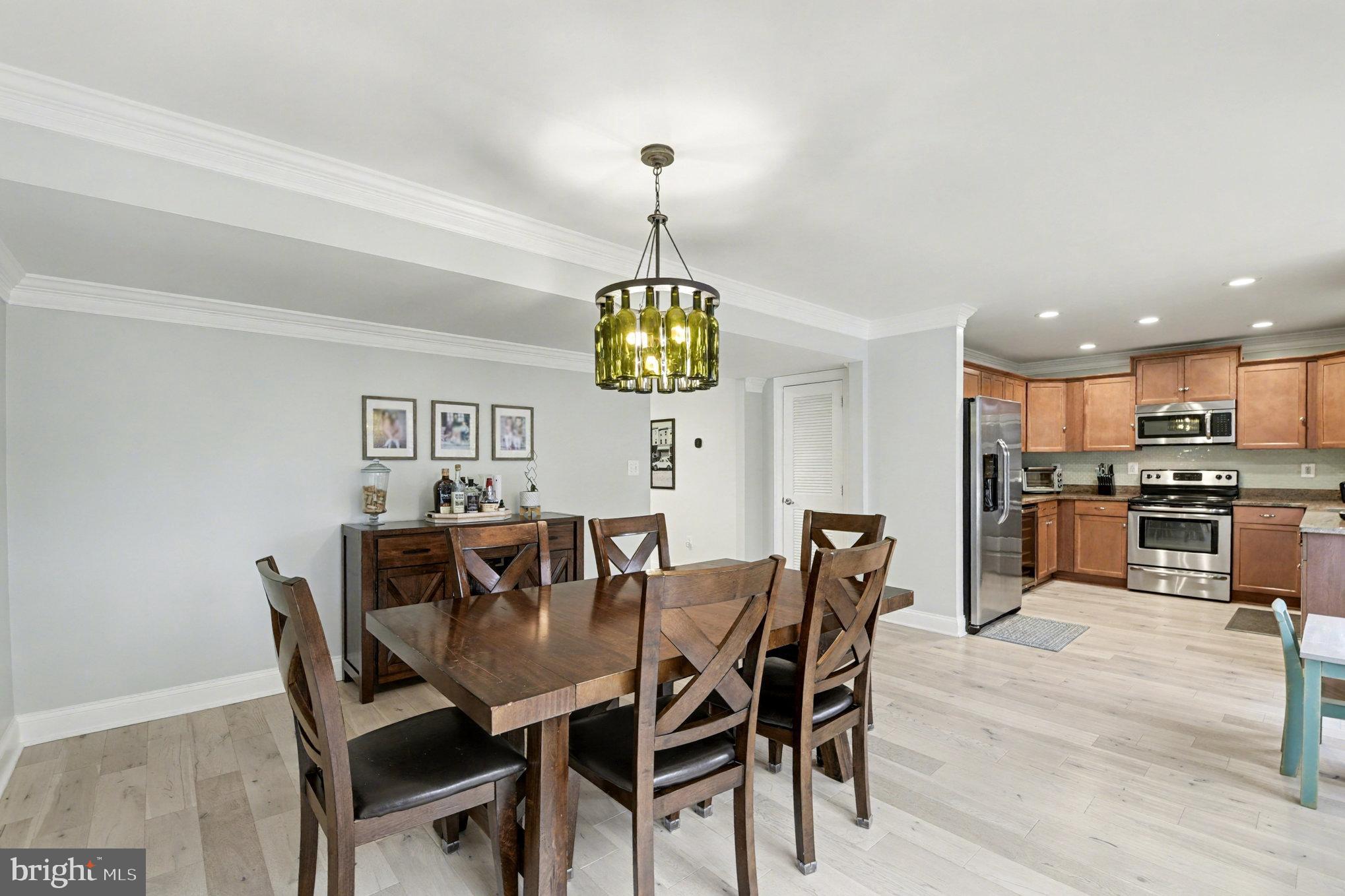 2804 7th Street Sparrows Point, MD 21219 - Photo 11 of 70 a view of a dining room with furniture and wooden floor