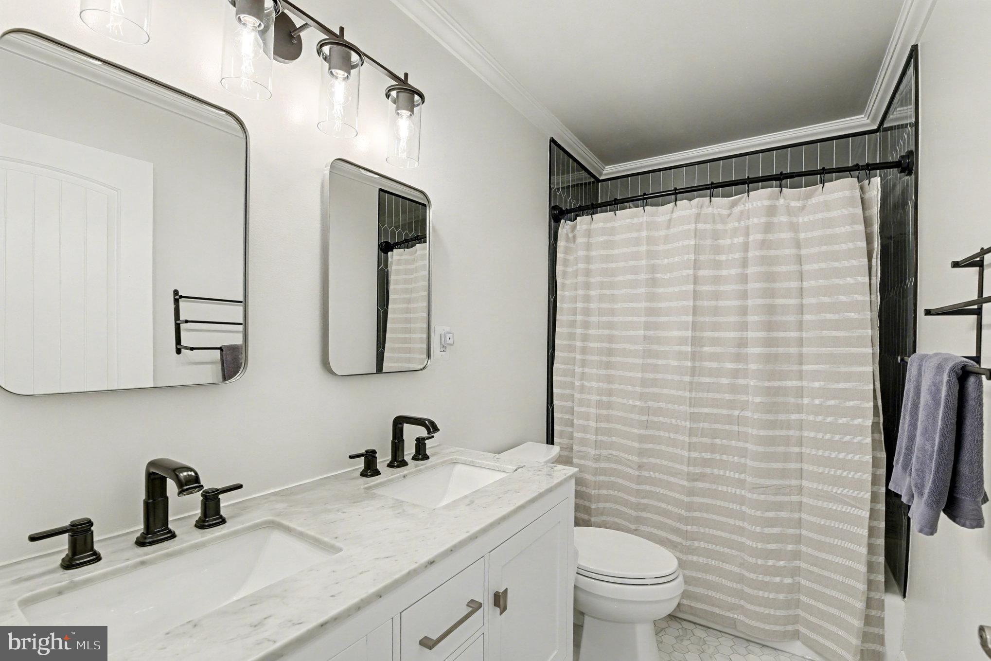 2804 7th Street Sparrows Point, MD 21219 - Photo 28 of 70 a bathroom with a sink and a mirror