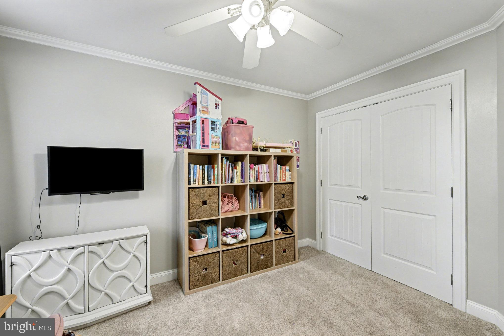 2804 7th Street Sparrows Point, MD 21219 - Photo 29 of 70 a living room with furniture and a flat screen tv