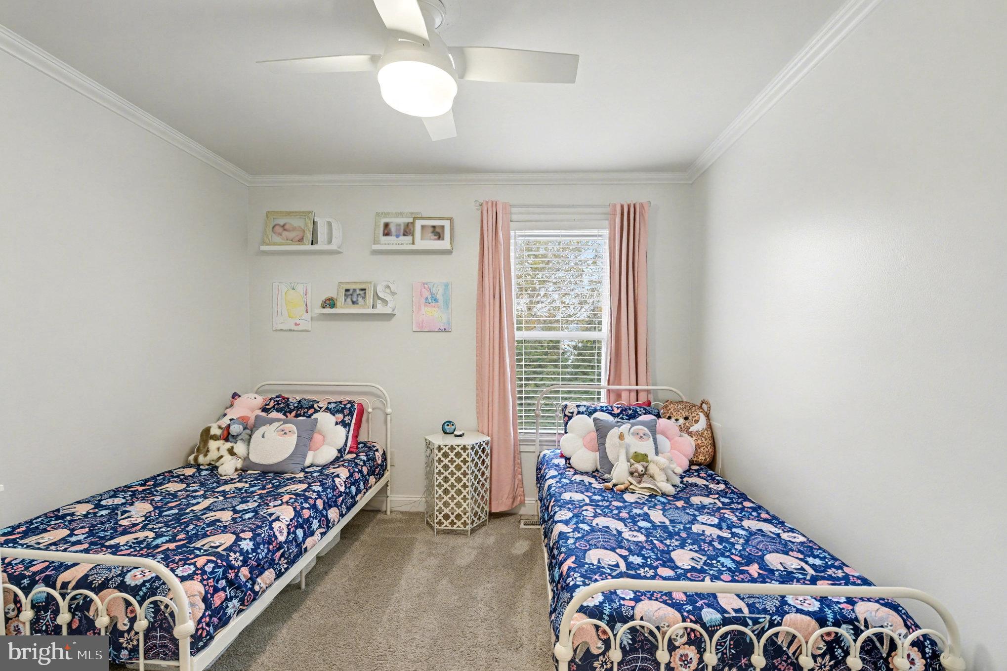 2804 7th Street Sparrows Point, MD 21219 - Photo 30 of 70 a bedroom with baby bed and a window