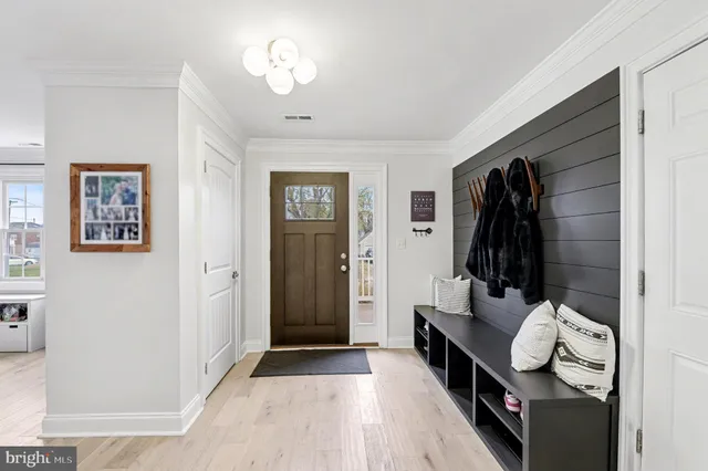 a view of a room with wooden floor and stairs