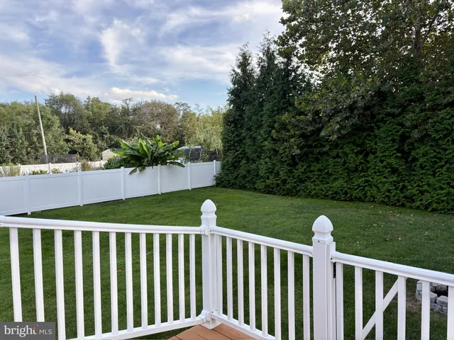 a view of a flat screen tv with wooden floor