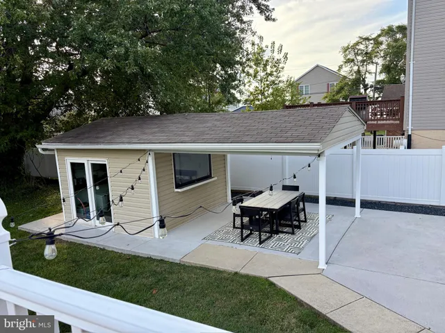 a view of a room with furniture and wooden floor