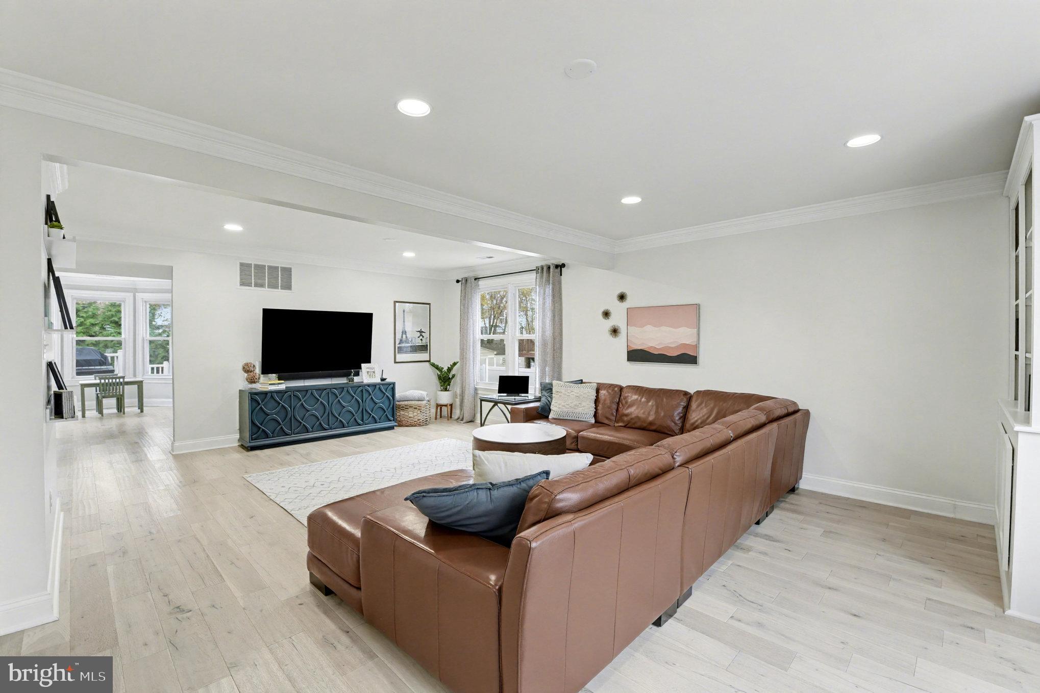 2804 7th Street Sparrows Point, MD 21219 - Photo 5 of 70 a living room with furniture and a flat screen tv