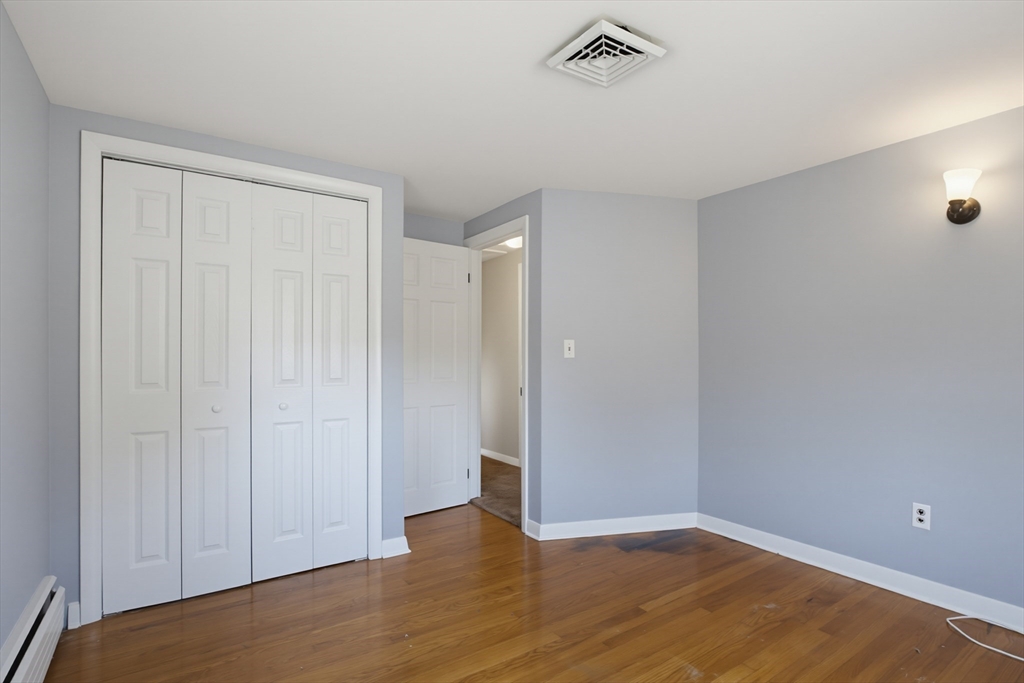 433 Pearse Road Swansea, MA 02777 - Photo 19 of 40 a view of an empty room with wooden floor