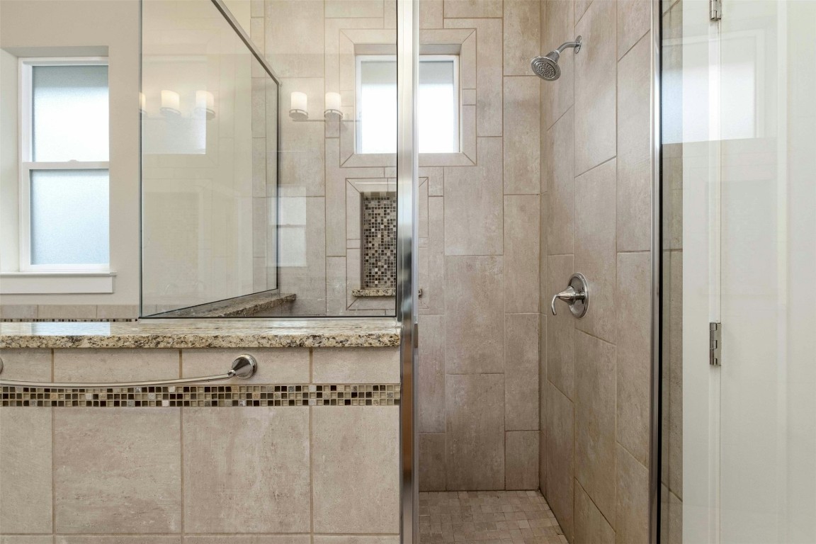 4008 Valley View Road, Unit B Austin, TX 78704 - Photo 12 of 21 a bathroom with a granite countertop shower and a sink