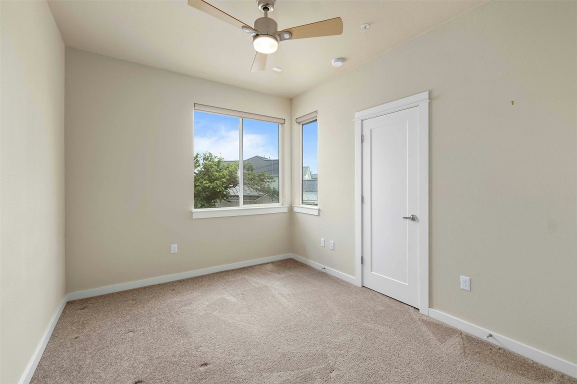 4008 Valley View Road, Unit B Austin, TX 78704 - Photo 15 of 21 an empty room with a window and a fan