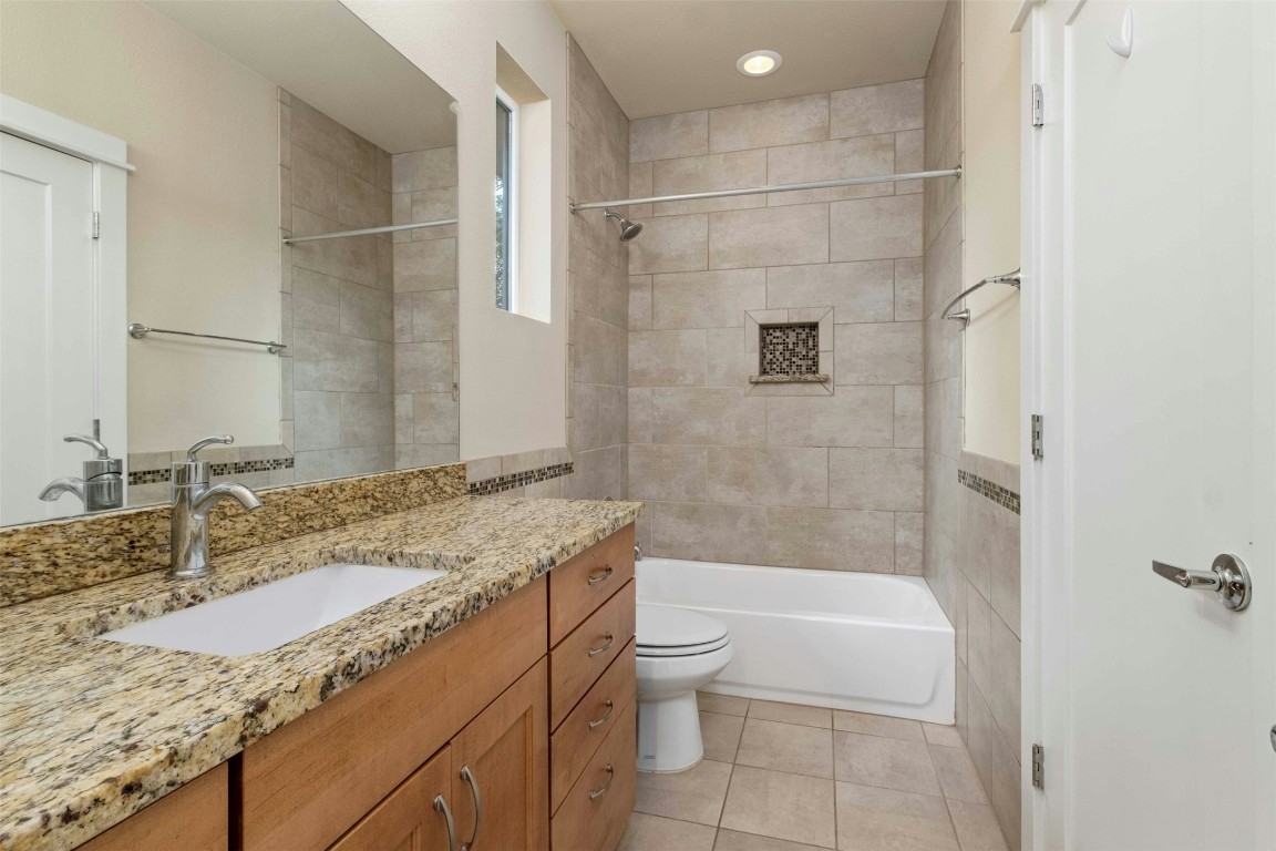4008 Valley View Road, Unit B Austin, TX 78704 - Photo 16 of 21 a bathroom with a granite countertop sink toilet and shower