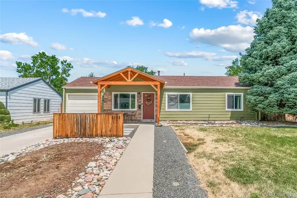 front view of a house with a yard