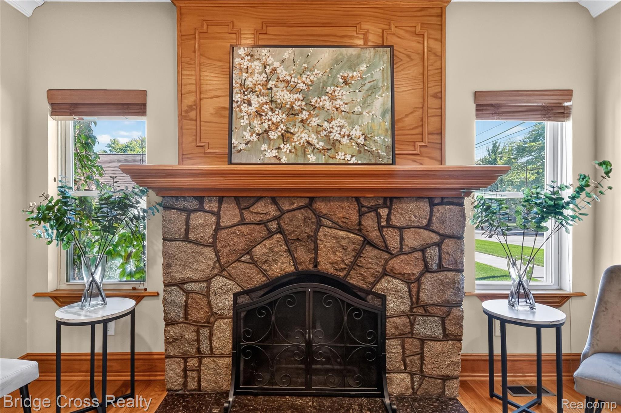 285 East Long Lake Road Troy, MI 48085 - Photo 11 of 49 Stone-clad fireplace with a decorative mantelpiece and wood-finish flooring