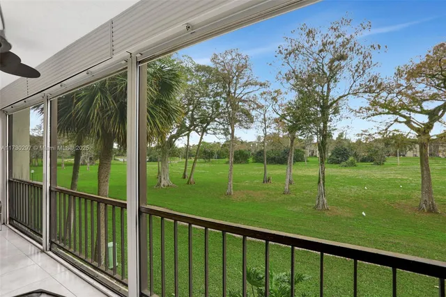 a view of a deck with a backyard