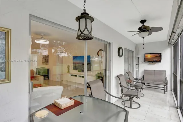 a view of a livingroom with furniture and a window