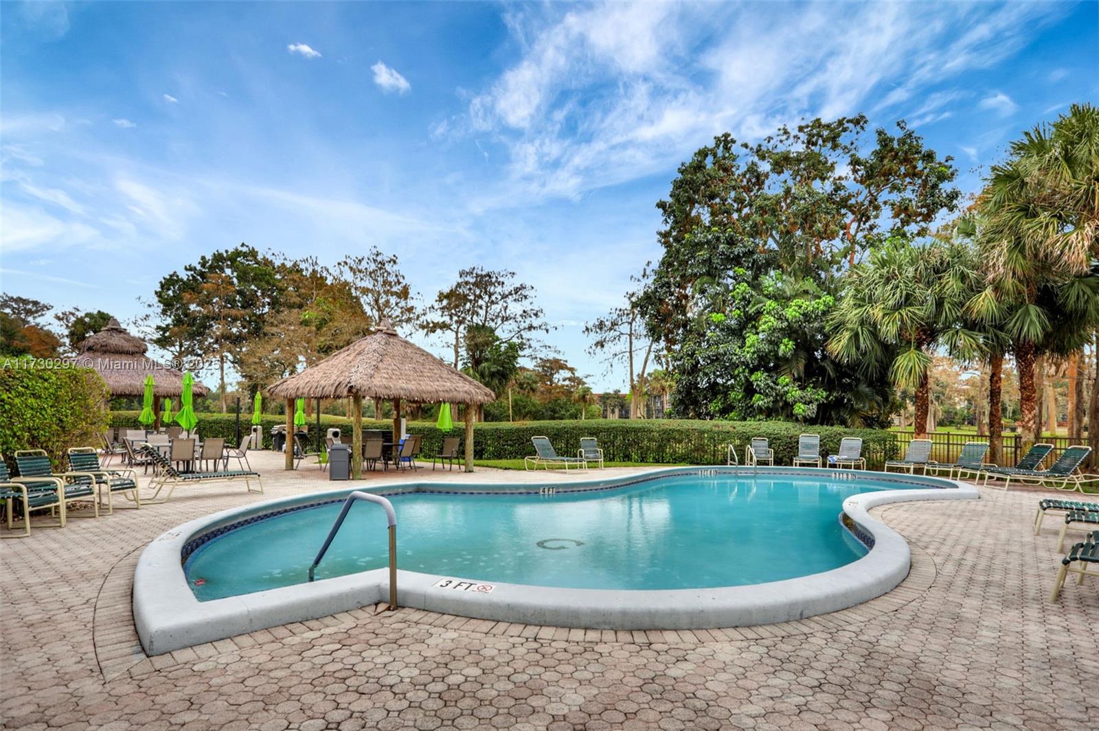 6080 Northwest 44th Street, Unit 212 Lauderhill, FL 33319 - Photo 36 of 44 a view of a swimming pool with a patio