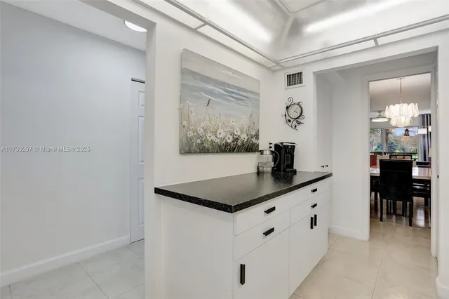 a room with a table and chairs