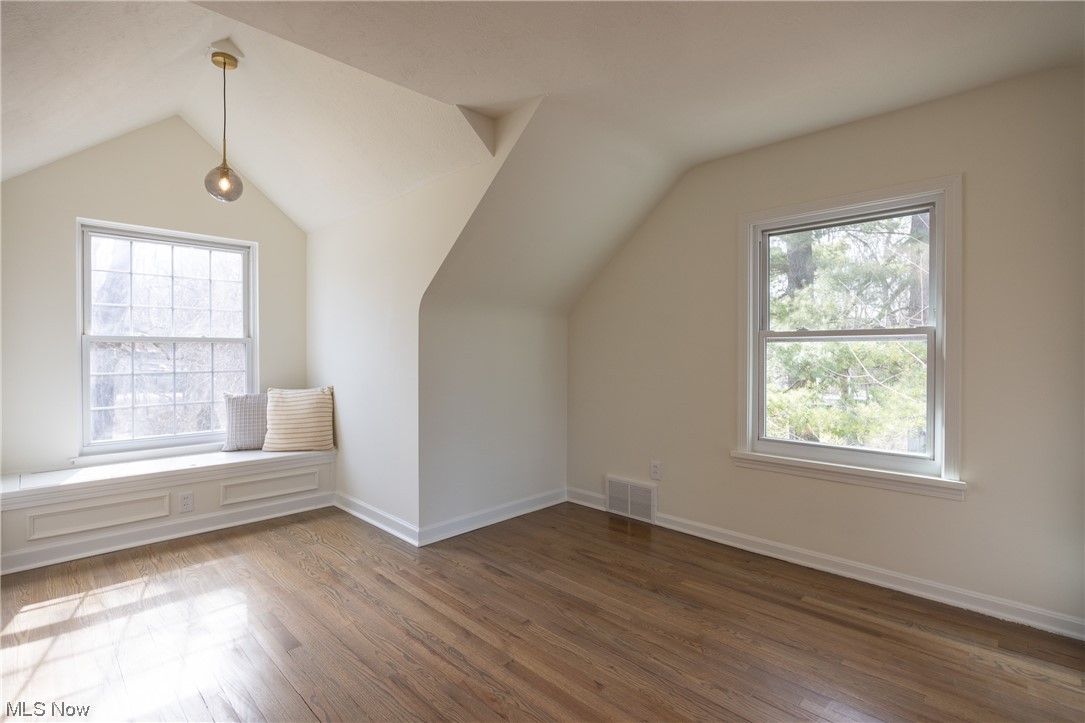 32887 Cedar Road Mayfield Heights, OH 44124 - Photo 23 of 44 Additional living space featuring vaulted ceiling and dark wood-type flooring