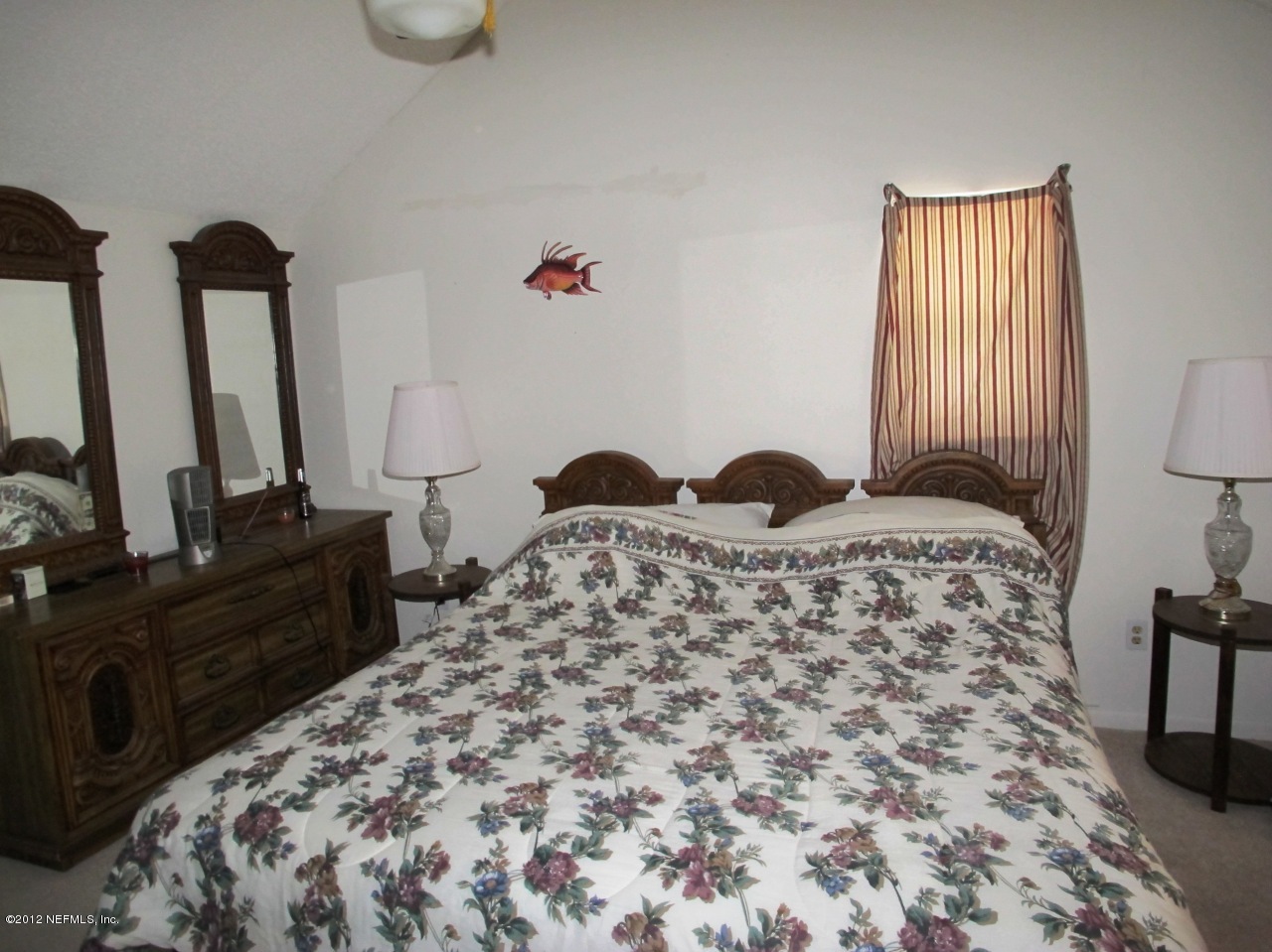 11745 Wattle Tree Road North Jacksonville, FL 32246 - Photo 12 of 18 a bedroom with a bed and wooden floor
