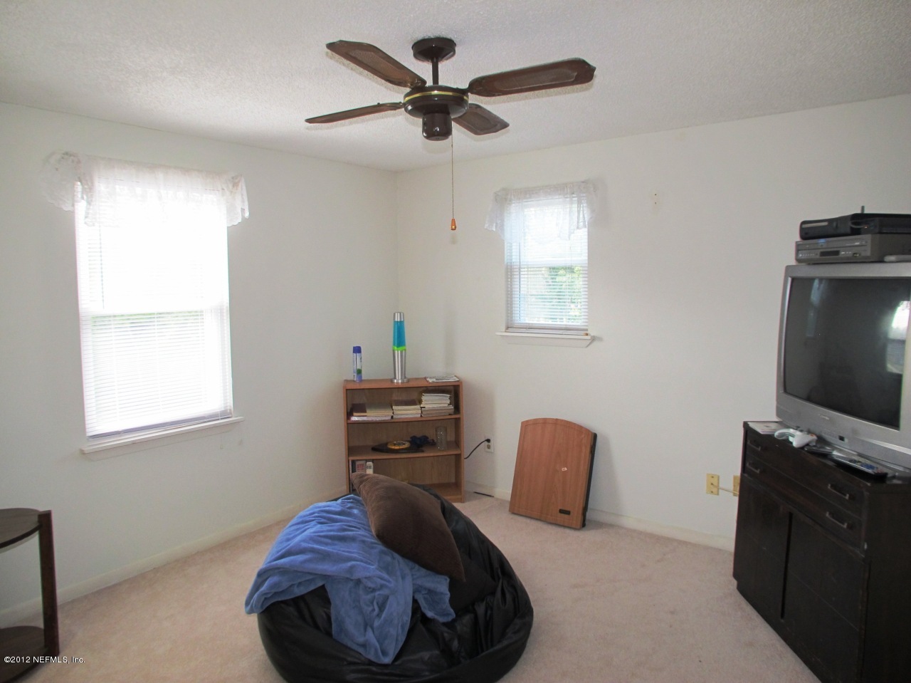 11745 Wattle Tree Road North Jacksonville, FL 32246 - Photo 13 of 18 a bedroom with furniture and a window