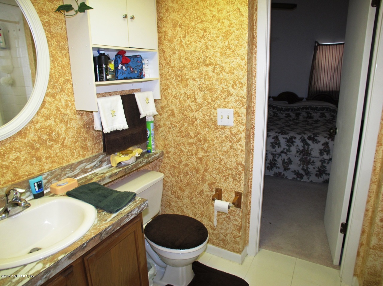 11745 Wattle Tree Road North Jacksonville, FL 32246 - Photo 14 of 18 a bathroom with a granite countertop sink and a mirror