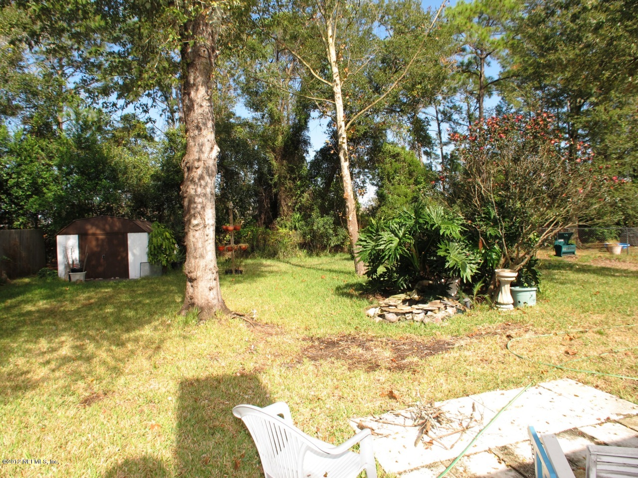 11745 Wattle Tree Road North Jacksonville, FL 32246 - Photo 17 of 18 a view of a yard with swimming pool