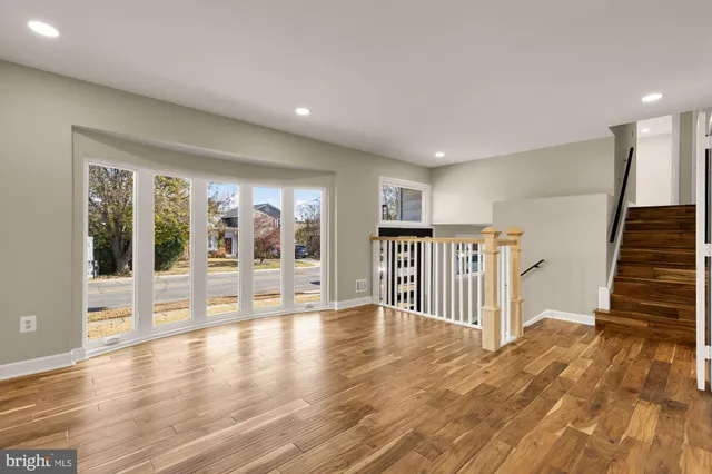 a view of an entryway with wooden floor