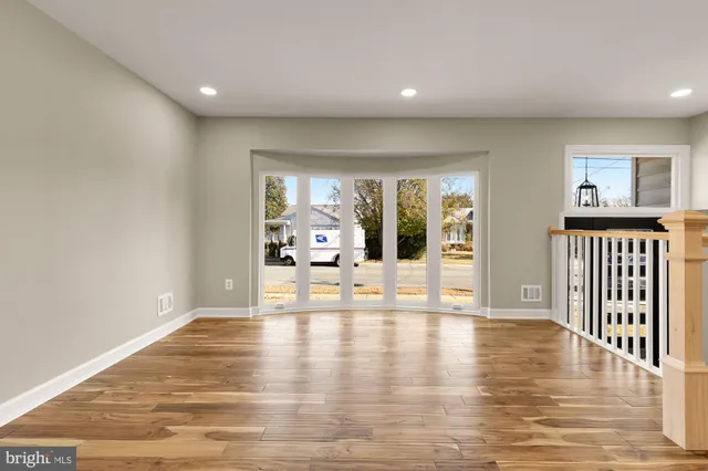 a view of an entryway with wooden floor