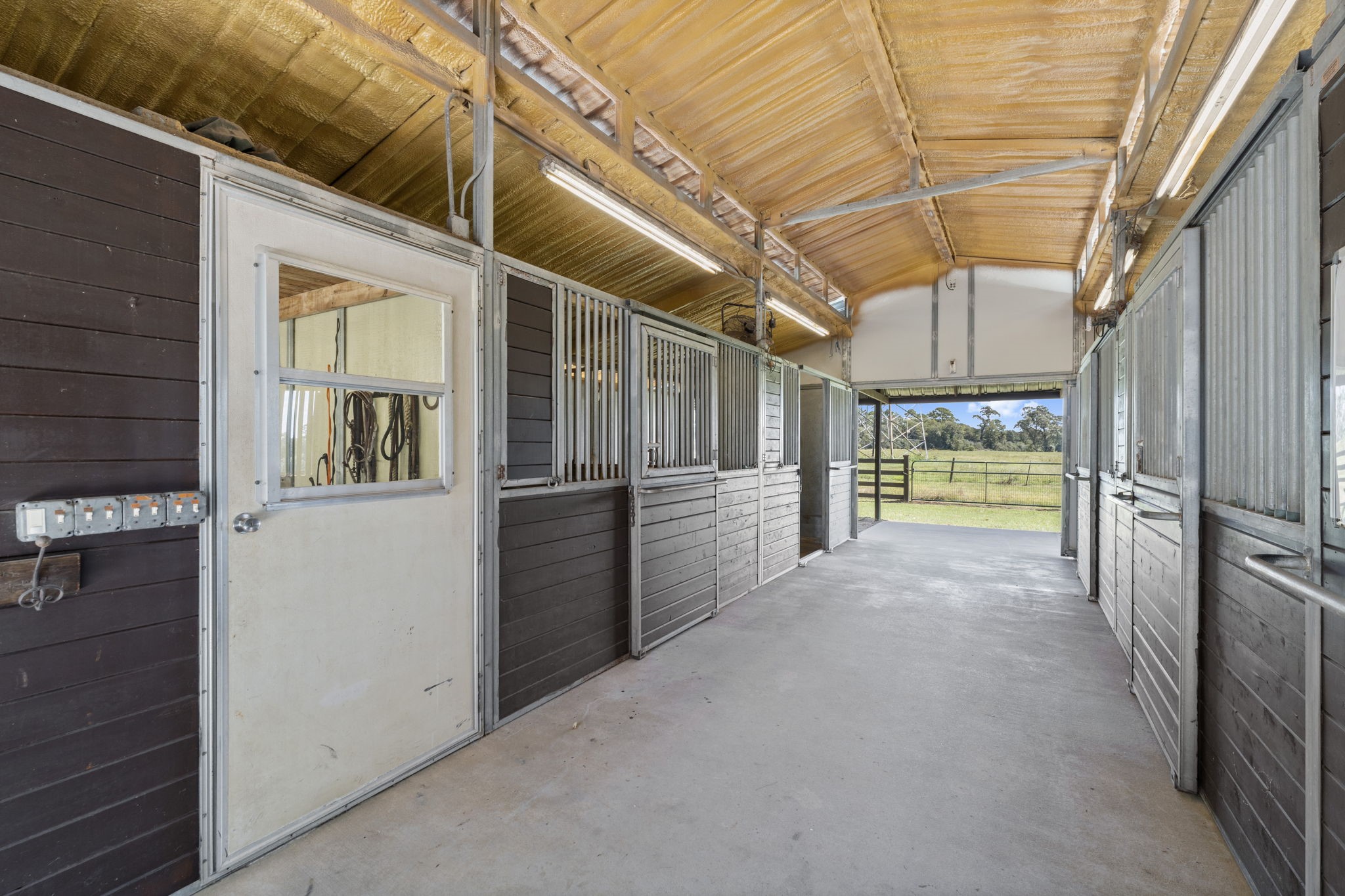 1534 Virgie Community Road Magnolia, TX 77354 - Photo 42 of 50 Notice the roof insulation that helps keep the intense sun from heating up the barn. Insulation in a barn makes a tremendous difference in internal temperatures.