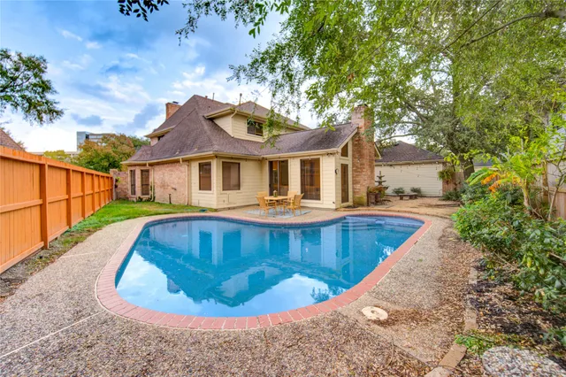 a view of a house with swimming pool