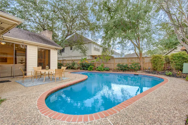 a view of a backyard with sitting area