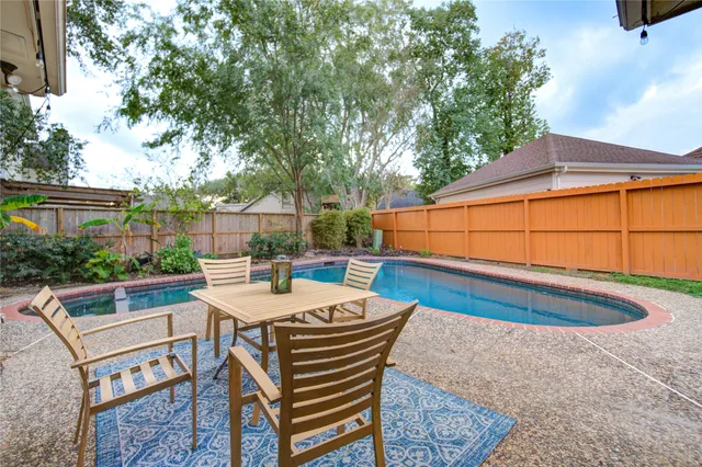 a front view of house with a garden and patio