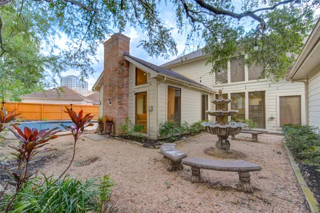 a view of a backyard with sitting area
