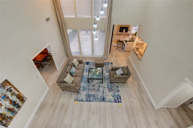 wooden floor stairs and a living room