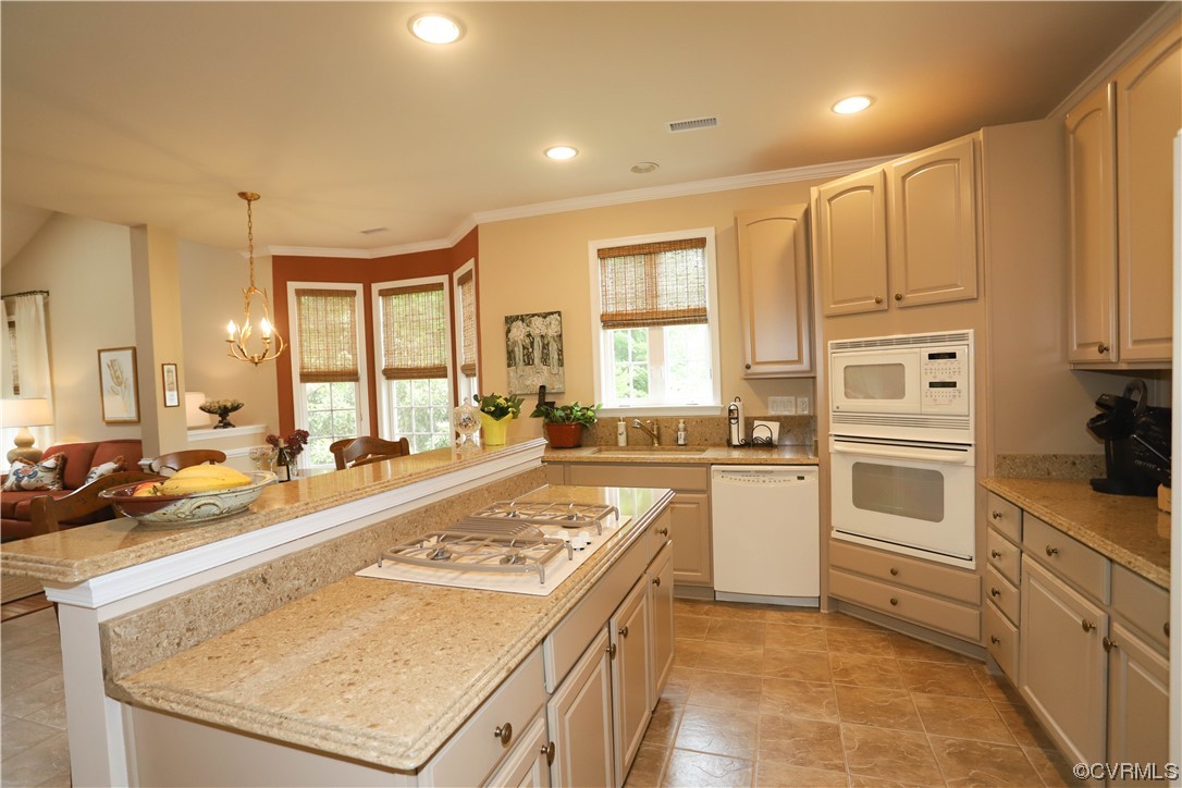 4748 Westhampton Williamsburg, VA 23188 - Photo 18 of 39 a kitchen with a stove a sink and a refrigerator